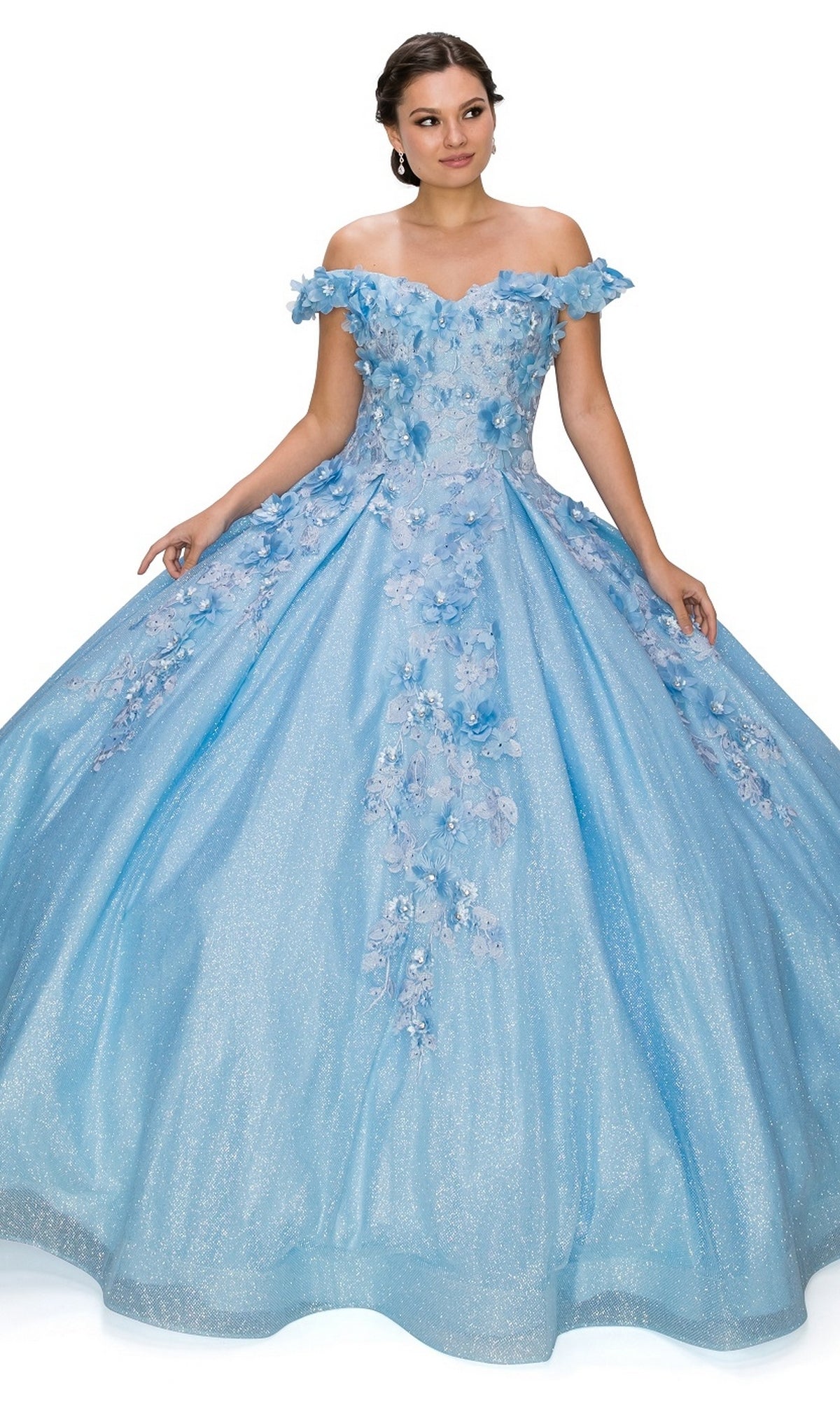 A woman wears the Quinceanera Ball Gown 8020J, an off the shoulder light blue dress with 3D floral details and a full glitter skirt.
